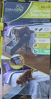Front of the box showing the product name, usage example with a dog on ramp, and features like foldability and height reach.