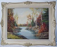 Full front view of the framed oil painting depicting a fall landscape with stream and trees.