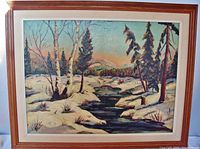 Frontal view of the oil painting in its wooden frame showing the entire winter landscape scene with snow and stream.