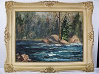 Full frontal view of framed oil painting showing detailed river scene with rocks and trees.