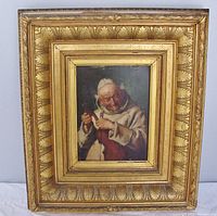 Frontal view of entire lot showing painting in ornate gold frame with damage