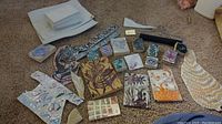 Overview of several printing blocks, stencils, and materials arranged on carpet.