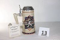 Photo showing the stein front featuring Mickey Mantle in batting action, with accompanying certificate unopened beside it.