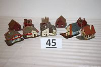 Full view of all 10 homes/buildings in the lot, including various completed and under construction models.