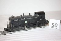 Front side view of the O-Scale Santa Fe Switcher Diesel Engine on display with marker number 50.