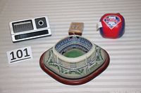 Photo of the Danbury Mint miniature of Veterans Stadium, the Phillies plush ball, and three desk items (calendar, pencil holder, thermometer).