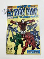 Front cover of the comic book showing Iron Man in red armor and other armored figures, with text including title, Marvel logo, pricing, and Comics Code Authority seal.
