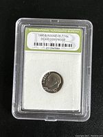 Photo of 1980-S Roosevelt 10 cent dime encapsulated in a clear plastic slab with label from International Numismatic Bureau indicating DCAM GEM PROOF grade.
