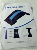 Photo of the back stretcher product image with part labels and features including board, magnet, massage, arch adjustment level, and stretcher slot.