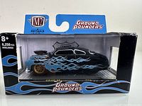 Front view of unopened M2 Machines Ground Pounders 1949 Mercury model car in original packaging.