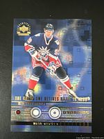 Front side of Wayne Gretzky Upper Deck hockey card in New York Rangers uniform, showing action pose and holographic elements