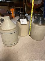 Photo of three vintage stoneware crocks showing general size and condition