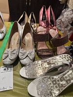 Overview of 5 pairs of women's shoes showing styles and colors