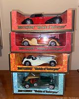 Four Matchbox 'Models of Yesteryear' die-cast cars in original boxes stacked vertically, showing the cars in window display.