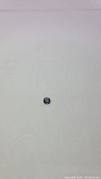 Oval lavender spinel gemstone displayed on a light background to show color, size, and shape clearly
