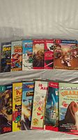 Full view of multiple children's books laid out, showing covers and titles from Step into Reading, World of Batman, and other series.
