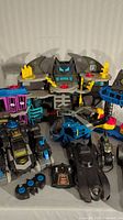 Full lot front view showing playset, vehicles, and controllers positioned for display.