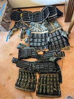 All components laid out on floor: three rows showing chest piece at top, sode in middle, kote and haidate below
