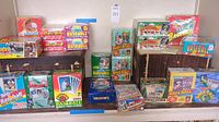 Multiple unopened hobby and retail baseball card boxes arranged on shelves