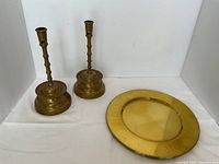 Overall view showing two candlesticks and one charger