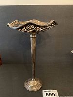 Front view showing wavy rim and lattice gallery