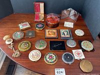 Wide view of all vanity items laid out on wood table