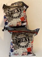 Photo showing two sealed Premium Sports Artifacts Sports packs containing NHL player figurines