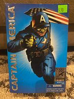 Front view of the Captain America action figure box showing the dynamic comic art and Comic-Con logo with $30 price sticker.