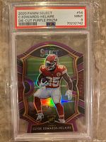 Front view of the Clyde Edwards-Helaire rookie card in protective PSA case showing player image, die-cut shape, purple prizm background, PSA grade label, and card number 54.