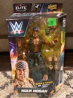 Front view of new packaged WWE Elite Collection Hulk Hogan action figure showing figure and included accessories inside blister pack.