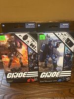 Two sealed GI Joe Classified Series action figures in original packaging: Cobra Firefly and Jason Shockwave Faria.