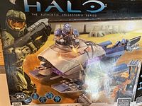 Box art of the Halo Covenant Brute Prowler Mega Bloks building set showing assembled vehicle and mini-figures.