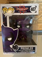 Front view of the sealed Pop! Funko box showing Prowler figure and branding with number 407 and Spider-Man: Into the Spider-Verse theme.