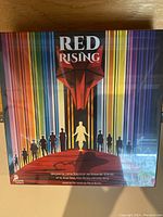 Front view of the sealed Red Rising board game box showing colorful art and title.