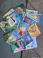 Collection of 18 Little Golden Books spread out showing various titles and illustrations.