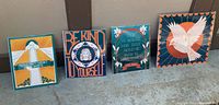 Four art prints arranged side by side showing designs and color schemes