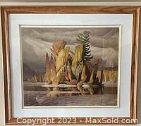 Framed artwork titled 'Little Island' by A.J. Casson, showing autumnal island scene, with artist signature visible on the bottom right. The frame is wooden and the dimensions are approximately 31 inches wide by 27 inches high.