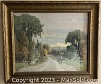Framed landscape oil painting showing a dirt road with trees in a late afternoon setting.