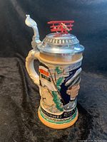 Red Baron German Beer Stein showing relief with pilot portrait, flags, and 