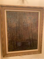 Frontal image of the painting in its ornate gold frame showing the full artwork depicting a wooded scene with a small bridge and stream, signed VH 211989.