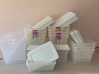 Overall group shot showing all plastic bins stacked with lids included