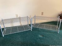 Two metal wire storage shelves shown side by side on carpeted floor, displaying overall size and construction.
