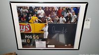 Full view of framed Aaron Judge photo showing frame, mat, autograph and display certificate