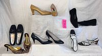 Full view of all six pairs of women's shoes size 9.5 showing a variety of styles and colors.