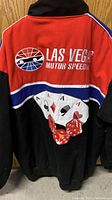 Back view of jacket showing Las Vegas Motor Speedway logo, playing cards, and dice graphic
