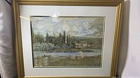 Full view of framed lithograph artwork in a gold-toned frame showing the entire piece including the surrounding mat.