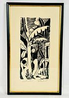 Full view of framed signed woodblock print in black frame with beige mat.