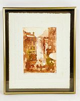Framed print with mat and glass showing a street scene in warm brown hues, indicating good overall condition with signature and edition number visible.
