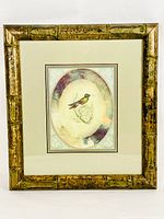 Full view of the framed print showing Brazilian hummingbird artwork with bamboo motif frame.