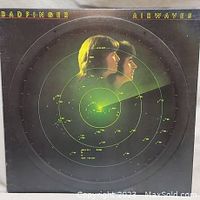 Front cover of Badfinger 'Airwaves' vinyl record packaging showing radar design with band members' side profiles.